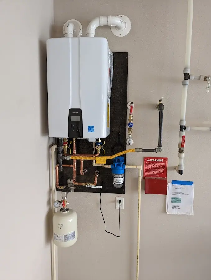 Professional plumber installing copper piping in a Cheney home